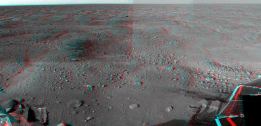 This anaglyph was acquired by NASA's Phoenix Lander; in the bottom left is a trench dug by Phoenix's Robotic Arm. In the bottom right is one of Phoenix's two solar panels. You will need 3-D glasses to view this image.