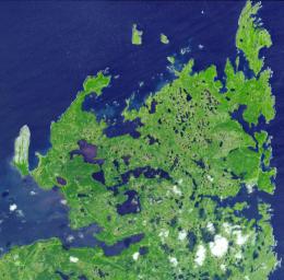 L'Anse aux Meadows is a site on the northernmost tip of the island of Newfoundland, located in the Province of Newfoundland and Labrador, Canada, where the remains of a Viking village were discovered in 1960. This image is from NASA's Terra satellite.