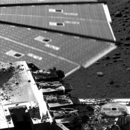 Winds were strong enough to cause about a half a centimeter (.19 inch) of motion of a solar panel on NASA's Phoenix Mars lander when the lander's Surface Stereo Imager took this picture on Aug. 31, 2008. The lander's telltale wind gauge can be seen.