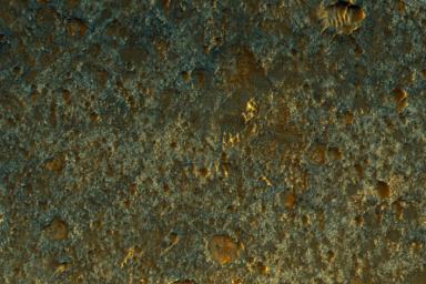NASA's Mars Reconnaissance Orbiter observed a small portion of a dark crater floor in the Tyrrhena Terra region of Mars. This is largely ancient hard bedrock that has been cratered by numerous impacts over the eons.