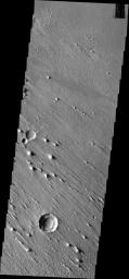 This image from NASA's Mars Odyssey shows erosion by winds in one direction. This image is located within Aeolis Planum.