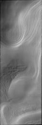 This image from NASA's Mars Odyssey shows beautiful swirling layers and surface textures at the south pole of Mars.