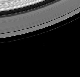 Prometheus and Epimetheus, brothers in Greek mythology, share the stage in NASA's Cassini spacecraft image of the two moons near the outer A ring and faint F ring, taken on Feb. 15, 2009.