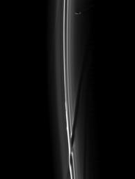 A soft collision between Prometheus and the F ring created the dark channel goring the ring in the bottom of this image from NASA's Cassini spacecraft taken on Feb. 2, 2009.