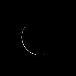 Only a sliver of Saturnian moon Dione is visible as NASA's Cassini spacecraft looks at the dark side of the moon. Here, only a narrow crescent reflects light forward toward Cassini's camera.