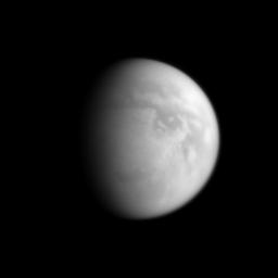 NASA's Cassini spacecraft image affords a view of Titan's south polar region, an area home to one of Titan's hydrocarbon 'lake districts.' Titan's south pole is illuminated to the right of the terminator near the bottom of the visible disk.