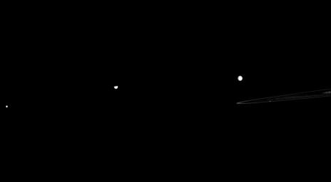 A quartet of Saturn's moons, Mimas, Tethys, Rhea, and Pandora, is seen here with the planet's F and A rings in this from NASA's Cassini spacecraft taken on April 11, 2009.