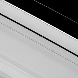 Atlas is seen in this image taken on March 23, 2009 by NASA's Cassini spacecraft with several background stars as the moon orbits within the Roche Division, the region between Saturn's A and F rings.