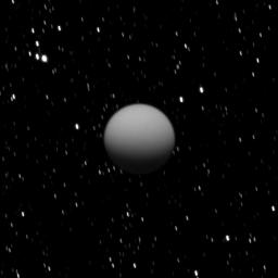 NASA's Cassini spacecraft captured this image of a dimly lit Titan as Saturn's largest moon was eclipsed by the planet.