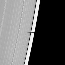 NASA's Cassini spacecraft captured the shadow of Saturn's tiny moon Pandora sneaking onto the planet's main rings on May 9, 2009.