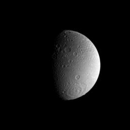 A large impact basin dominates the high southern latitudes of Saturn's moon Dione as seen by NASA's Cassini spacecraft.