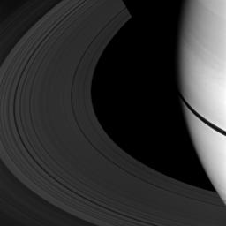 The shadows of Saturn's rings appear as a narrow band on the planet in this image taken as Saturn approaches its August 2009 equinox as seen by NASA's Cassini spacecraft.