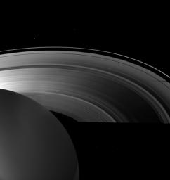 Saturn's moon Tethys casts a shadow on the planet's A ring alongside the larger shadow cast by the planet itself in this image from NASA's Cassini spacecraft taken as Saturn approached its August 2009 equinox.