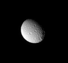 NASA's Cassini spacecraft looks down on the north pole of Mimas and sees the moon's cratered trailing hemisphere.