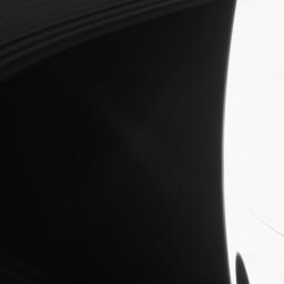 A big shadow from Saturn's largest moon darkens the planet in the lower right of this image taken by NASA's Cassini spacecraft shortly after Saturn's August 2009 equinox.