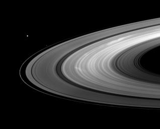 Saturn's moons Mimas and Pandora join bright B ring spokes in this image from NASA's Cassini spacecraft captured on Aug. 30, 2009.