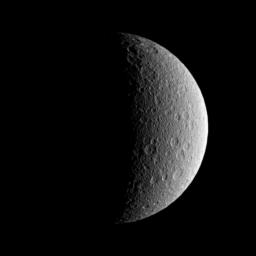 NASA's Cassini spacecraft looks toward the battered surface of the moon Rhea.