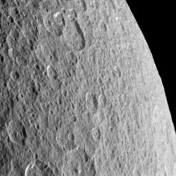 Craters imprinted upon other craters record the long history of impacts endured by Saturn's moon Rhea; this image was taken by NASA's Cassini spacecraft.