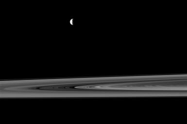 NASA's Cassini spacecraft captures a couple of small moons in this image taken while the spacecraft was nearly in the plane of Saturn's rings.