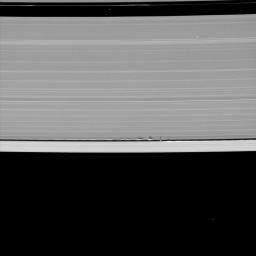 Looming vertical structures created by the tiny moon Daphnis cast long shadows across the rings in this startling image taken by NASA's Cassini spacecraft on May 24, 2009, as Saturn approaches its mid-August 2009 equinox. 