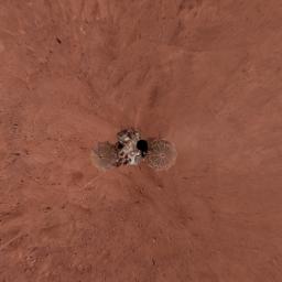 This view is a vertical projection that combines more than 500 exposures taken by NASA's Mars Phoenix Lander and projects them as if looking down from above. The black circle on the spacecraft is where the camera itself is mounted on the lander.