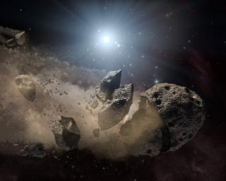 NASA's Spitzer Space Telescope set its infrared eyes upon the dusty remains of shredded asteroids around several dead stars. This artist's concept illustrates a 'white dwarf,' surrounded by the bits and pieces of a disintegrating asteroid.