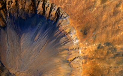This impact crater, as seen by NASA's Mars Reconnaissance Orbiter, appears relatively recent as it has a sharp rim and well-preserved ejecta.