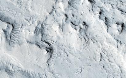 This observation from NASA's Mars Reconnaissance Orbiter locates what appears to be a graben (a fault-bounded valley) on a large scale, and locally became a vent region for lava flows.