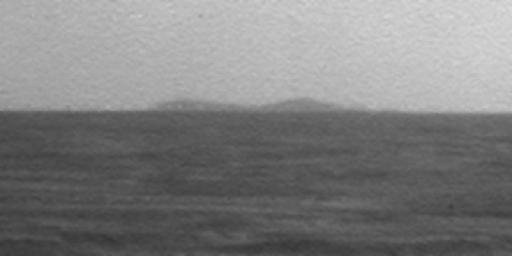 A northern portion of the rim of Endeavour Crater is visible on the horizon of this image taken by NASA's Mars Exploration Rover Opportunity on March 7, 2009.