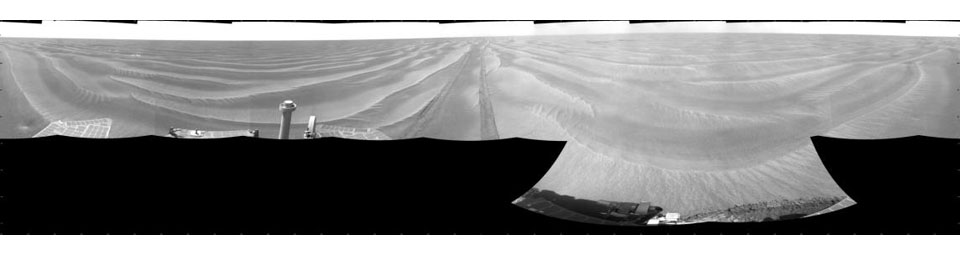 NASA's Opportunity had driven 72.3 meters southward (237 feet) that sol. Engineers drove the rover backward as a strategy to counteract an increase in the amount of current drawn by the drive motor of the right-front wheel. This is a cylindric projection.
