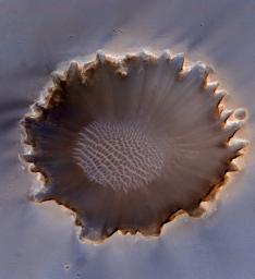 This image of Victoria Crater in the Meridiani Planum region of Mars was taken by the High Resolution Imaging Science Experiment (HiRISE) camera on NASA's Mars Reconnaissance Orbiter at more of a sideways angle than earlier orbital images of this crater.