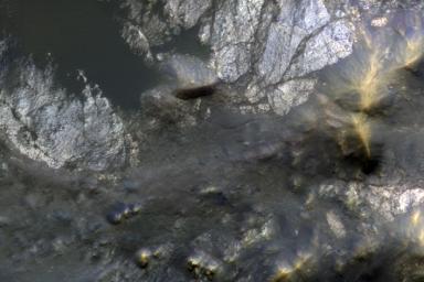 This color composite from NASA's Mars Reconnaissance Orbiter shows an example of bedrock that may originate from as deep as 2 miles beneath the surface.