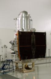 NASA's Wide-field Infrared Survey Explorer, or WISE, spacecraft sits on the test stand after connection to the conical adapter.