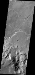 Taken by NASA's 2001 Mars Odyssey spacecraft, this image shows a fan shaped deposit located on the floor of Holden Crater.