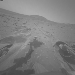 This image is one of two images which documents very slight forward movement of NASA's Mars Exploration Rover Spirit during a drive on the rover's 2,090th Martian day, or sol (Nov. 19, 2009).