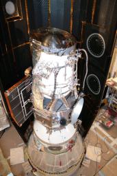 NASA's Wide-field Infrared Survey Explorer is shown inside one-half of the nose cone, or fairing, that will protect it during launch.