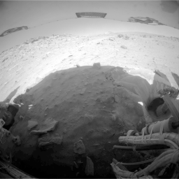 This image is one of two frames showing NASA's Spirit driving backward as next technique for attempting to extricate the rover from the sand trap where it is embedded. Go to the Photojournal for the animation.