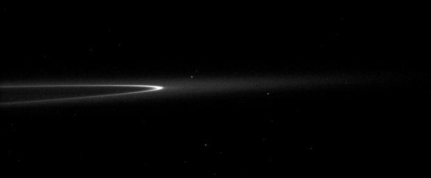 In this image taken by NASA's Cassini spacecraft, the bright arc in Saturn's faint G ring contains a little something special. Although it can't be seen here, the tiny moonlet Aegaeon orbits within the bright arc.
