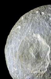 Subtle color differences on Saturn's moon Mimas are apparent in this false-color view of Herschel Crater captured during NASA's Cassini spacecraft on its closest-ever flyby of that moon.