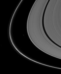Saturn's tiny moon Atlas, just to the left of the center of the image, appears almost indistinguishable from the background stars seen in this image captured by NASA's Cassini spacecraft.