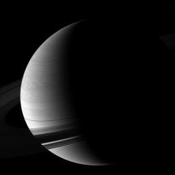 NASA's Cassini spacecraft looks down and pictures Saturn wrapped in a pencil-thin shadow of the rings just days after the planet's August 2009 equinox. The moon Epimetheus (not shown) is casting a tiny shadow on the planet above the rings.