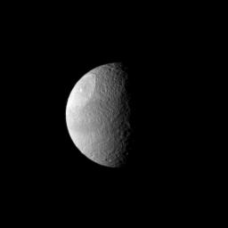 A huge impact created Odysseus Crater, which covers a large part of Saturn's moon Tethys in this image from NASA's Cassini spacecraft.