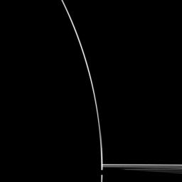A startling silhouette of Saturn is created in this NASA Cassini spacecraft portrait.