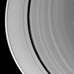 Kinky, discontinuous ringlets occupy the Encke Gap in Saturn's A ring in the middle of this NASA Cassini spacecraft image; parts of these thin ringlets cast shadows onto the A ring.