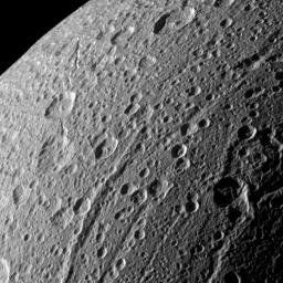 NASA's Cassini spacecraft swooped in for a close-up of the cratered, fractured surface of Saturn's moon Dione in this image taken during the spacecraft's Jan. 27, 2010, non-targeted flyby.