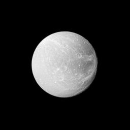 Wispy terrain stretches across the trailing hemisphere of Saturn's moon Dione on the right of this image taken by NASA's Cassini spacecraft during the spacecraft's flyby on April 7, 2010.
