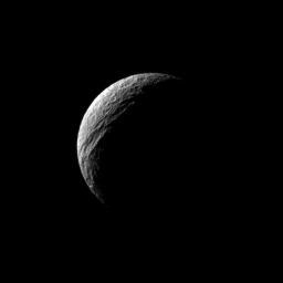 Sunlight illuminates the deep cut of Ithaca Chasma on Saturn's moon Tethys. Ithaca Chasma runs roughly north-south for more than 1,000 kilometers (620 miles) on Tethys in this image captured by NASA's Cassini spacecraft.