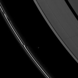 Saturn's moon Prometheus casts a long shadow across the A ring in the middle-right side of this image taken shortly before the planet's August 2009 equinox by NASA's Cassini spacecraft.
