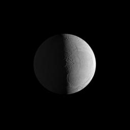 Two sources of light reveal the dramatic surface of Saturn's moon Enceladus in this NASA Cassini image in which geologic features give the appearance of the leathery skin of an elephant.