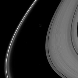 Delicate shadows are cast outward from Saturn's thin F ring in the lower left of this image taken as the planet approached its August 2009 equinox. The moon Atlas (30 kilometers, or 19 miles across) is seen just above the center of the image.